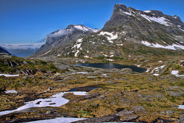 Fototapeta na wymiar Melting snow in the Norwegian mountains