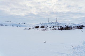 Snow-white road without cars after a blizzard in the countryside