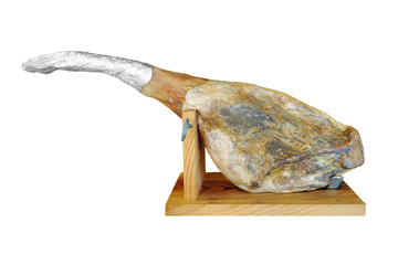 Pig leg serrano ham on a support isolated on a white background