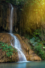 Fototapeta na wymiar Phu Sang waterfall is a waterfall that is rare in Thailand. The hot waterfall is 35 -36 degrees Celsius, located on the mountain cliff in Phayao, Thailand.