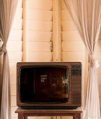 Retro vintage old design TV television in living room
