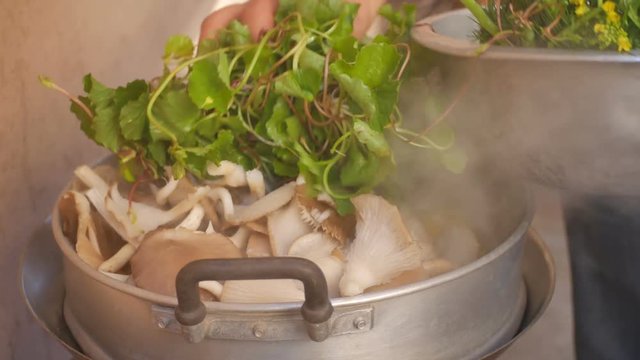 people put the centella vegetable in to the steamed pot for cooking