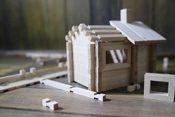 Toy wooden house. The constructor is made of natural wood for ch