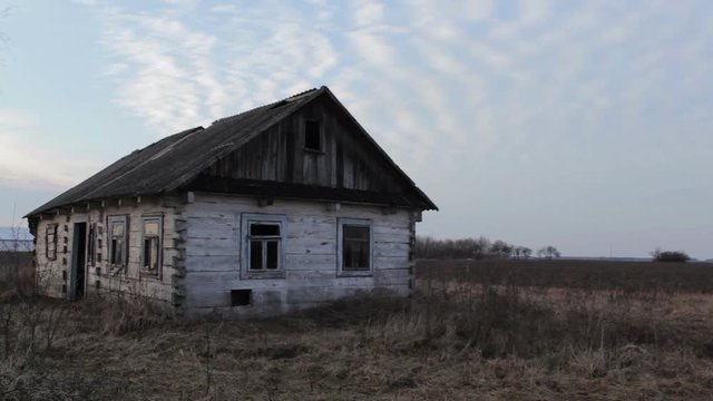 abandoned wooden house,old abandoned wooden house in the field of autumn