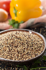 Mix of organic white, yellow and black quinoa, dietary and healthy food