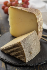 Tasting of ancient french demi soft cheese Tomme from French Alps, made from cow, goat or sheep skim milk, low fat french cheese