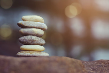 Balance stones on abstract bokeh background with copy space for spa concept