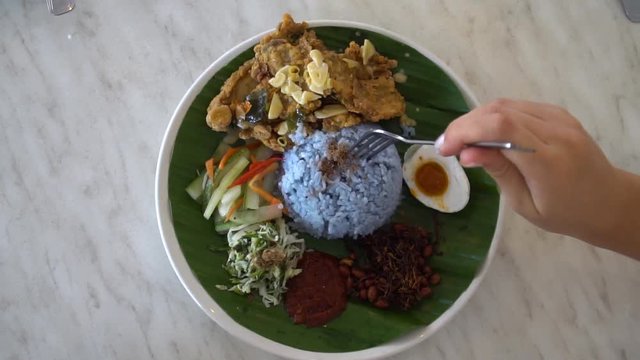 Eating Nasi Kerabu - Traditional Malaysian Dish