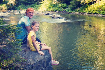 Fototapeta premium Hikers - happy father and teenage daughter
