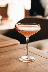 Delicious alcohol cocktail on wooden table
