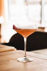 Delicious alcohol cocktail on wooden table