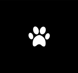 Fototapeta na wymiar White animal paw print icon isolated on black background.