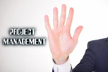 A businessman shows an inscription:PROJECT MANAGEMENT