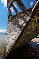 Wooden ship wreck on the beach