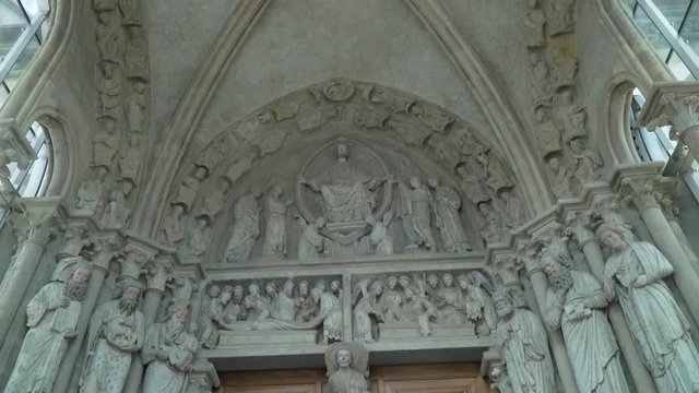 Jesus Christ and the disciples. Lord's supper stone carving at a church's entrance