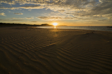 Fototapeta na wymiar Sunrise over Petreborough beach