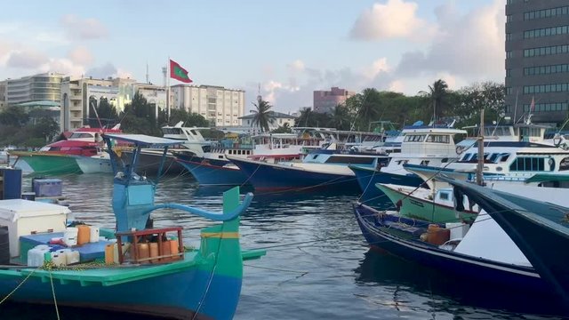 MALE', MALDIVES - MARCH 2015: City port with boats. Male' in the central hub for Maldives