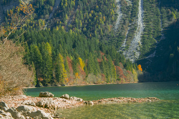 autumnal view of the Tovel Lake, Trentino Italy.
