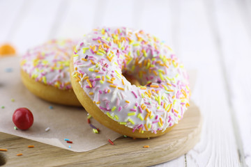 Donut on a wooden white background