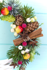 Christmas wreath on a wooden background. Holidays