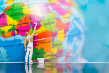 Miniature people : Painters painting on The globe  background