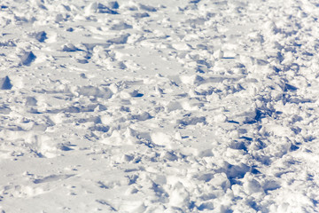 Obraz premium Footprints in the snow. Sunny winter's day. Drift.