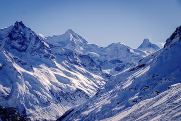 Zinal Alps panorama from Sorbois mountain station in Switzerland. The village is a typical Swiss ski resort linked with Grimentz to form a great skiing area