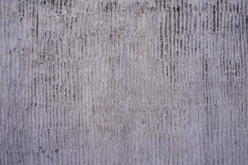 Old weathered gray stone surface with stripes - background, texture, limestone
