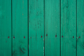 Green wooden board with nails - wooden background