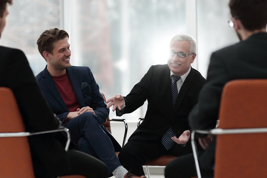 senior businessman holds a meeting with the business team