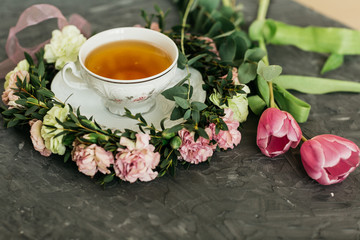 Obraz na płótnie Canvas Cup of tea, flowers, herbs, tulips, Flatlay