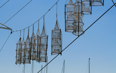 Fishing nets - a fisherman's equipment hanging on the fishing boat.