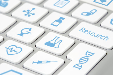 closeup of medical research icons on keyboard buttons