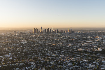 Early morning aerial view of buildings and streets near urban downtown Los Angeles, California.