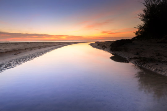 sunset seascape with reflection. © udoikel09