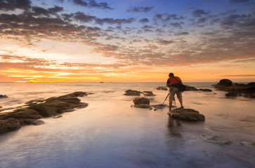 sunset seascape with natural coastal rocks. nature composition