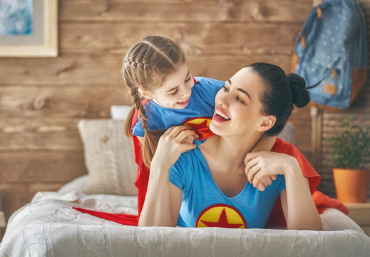 Girl and mom in Superhero costume
