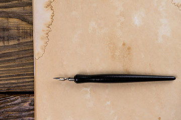 Mock up. Pile of old ancient manuscripts of the old fountain pen on a wooden table. Copy space