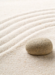 Zen sand and stone garden with raked curved lines. Simplicity, concentration or calmness abstract concept