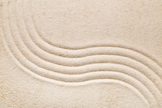 Zen sand and stone garden with raked lines, curves and circles. Simplicity, concentration or calmness abstract concept