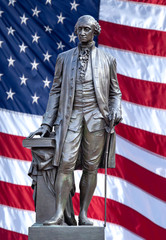 Isolated statue of George Washington, Independence Hall, Philadelphia, PA. The United States flag...