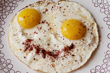 Fried eggs with a smile of seasoning