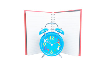 Blue retro alarm clock with book isolated on white background