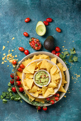 Mexican nachos served with guacamole