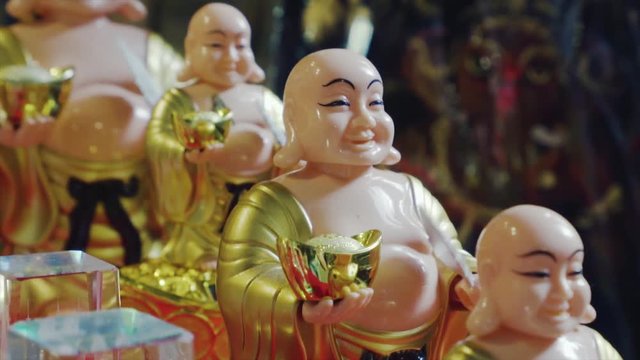 Gift movable figurine of the Buddha at souvenir shop in Kuala Lumpur, Malaysia 4K