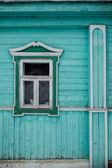 wooden wall with a small window
