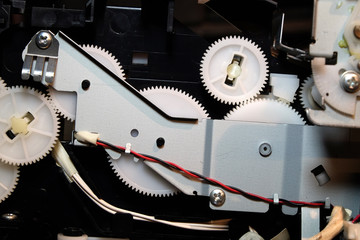 Gears, cogs and drive mechanism in modern inkjet printer.