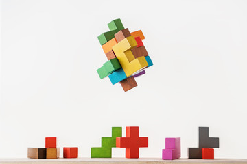 Colorful constructor, logic game, cubic mosaic. Design created by cubes. The concept of logical thinking, geometric shapes.