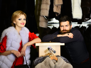 Woman in mink fur coat with smiling face and man