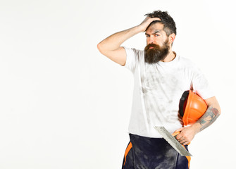 Man with painful face touches forehead. Builder, plasterer,